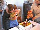 Ekin is blowing her 2nd birthday cake.